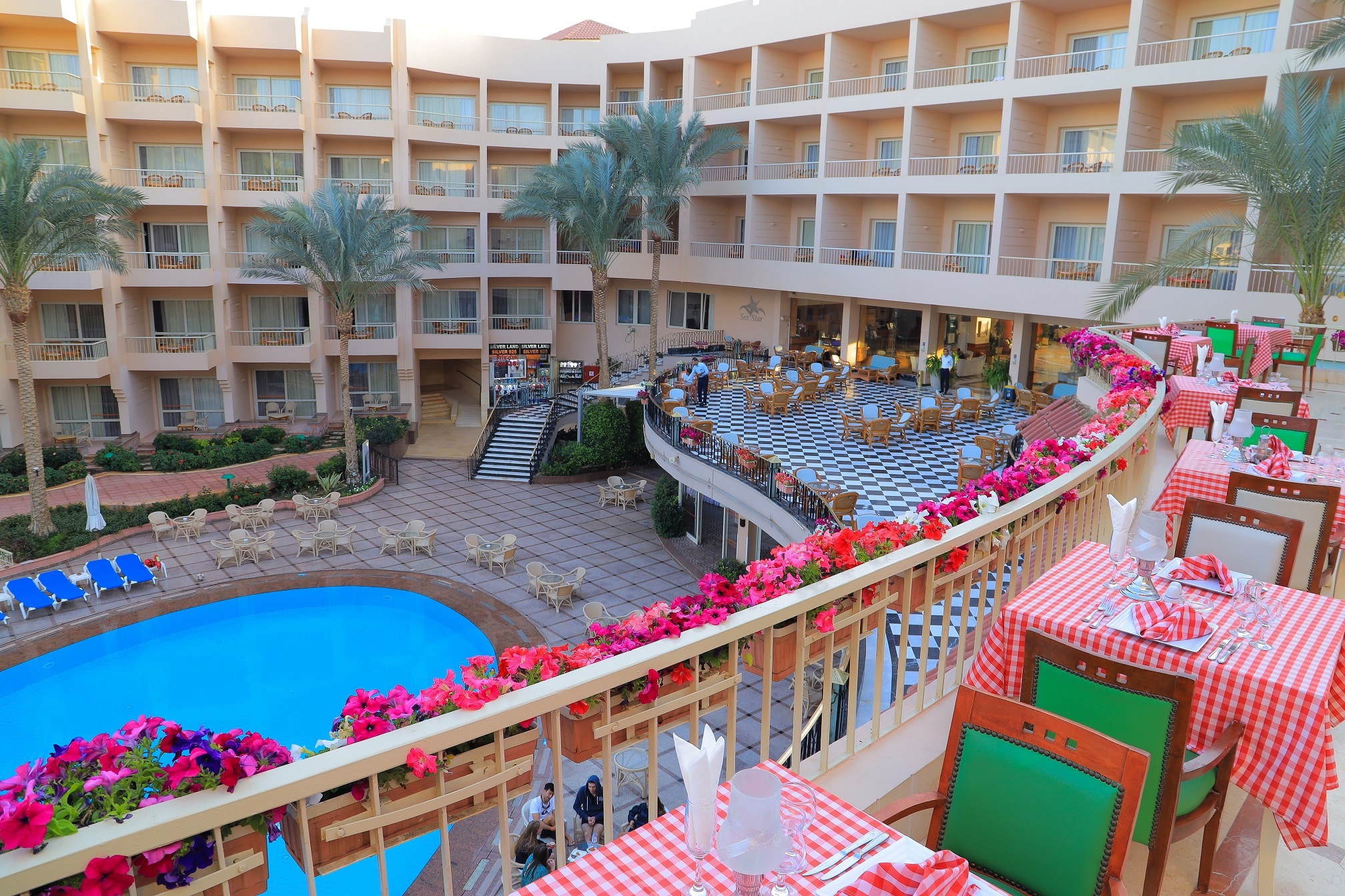 Dining terrace with pool view